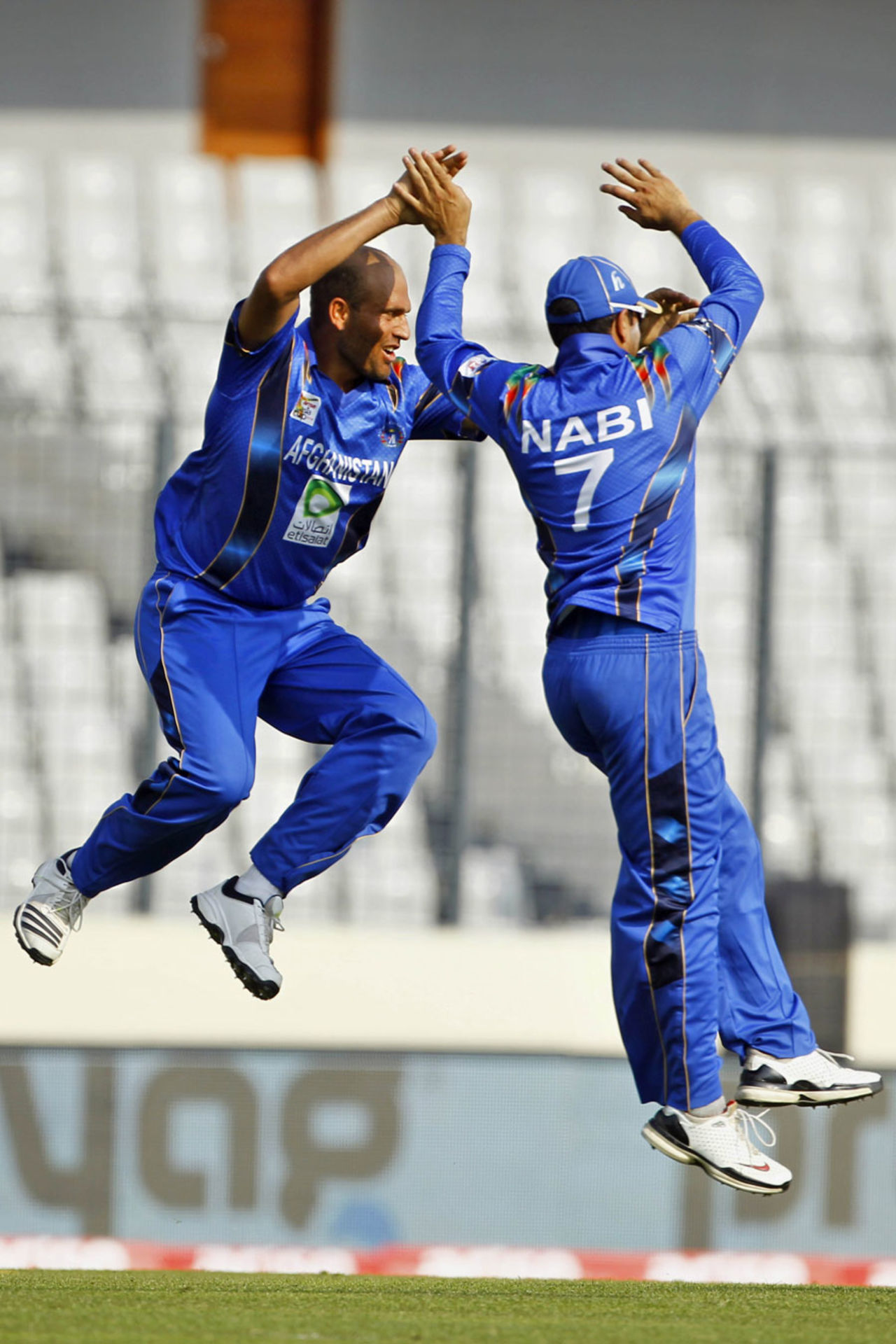 Mirwais Ashraf and Mohammad Nabi leap in celebration, Afghanistan v Sri Lanka, Asia Cup, Mirpur