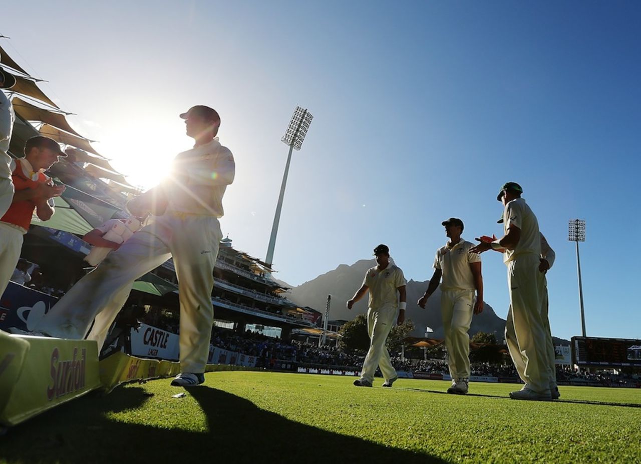 Australia players walk off after bowling out South Africa, South Africa v Australia, 3rd Test, Cape Town, 3rd day, March 3, 2014