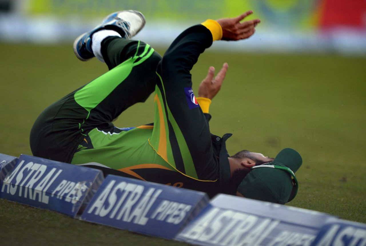 Ahmed Shehzad dives trying to stop a boundary, Bangladesh v Pakistan, Asia Cup, Mirpur, March 4, 2014