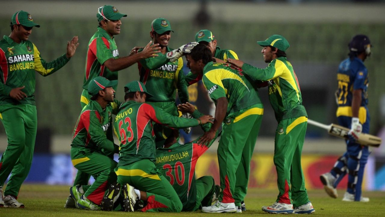 Rubel Hossain is mobbed after he ran out Mahela Jayawardene, Bangladesh v Sri Lanka, Asia Cup, Mirpur, March 6, 2014