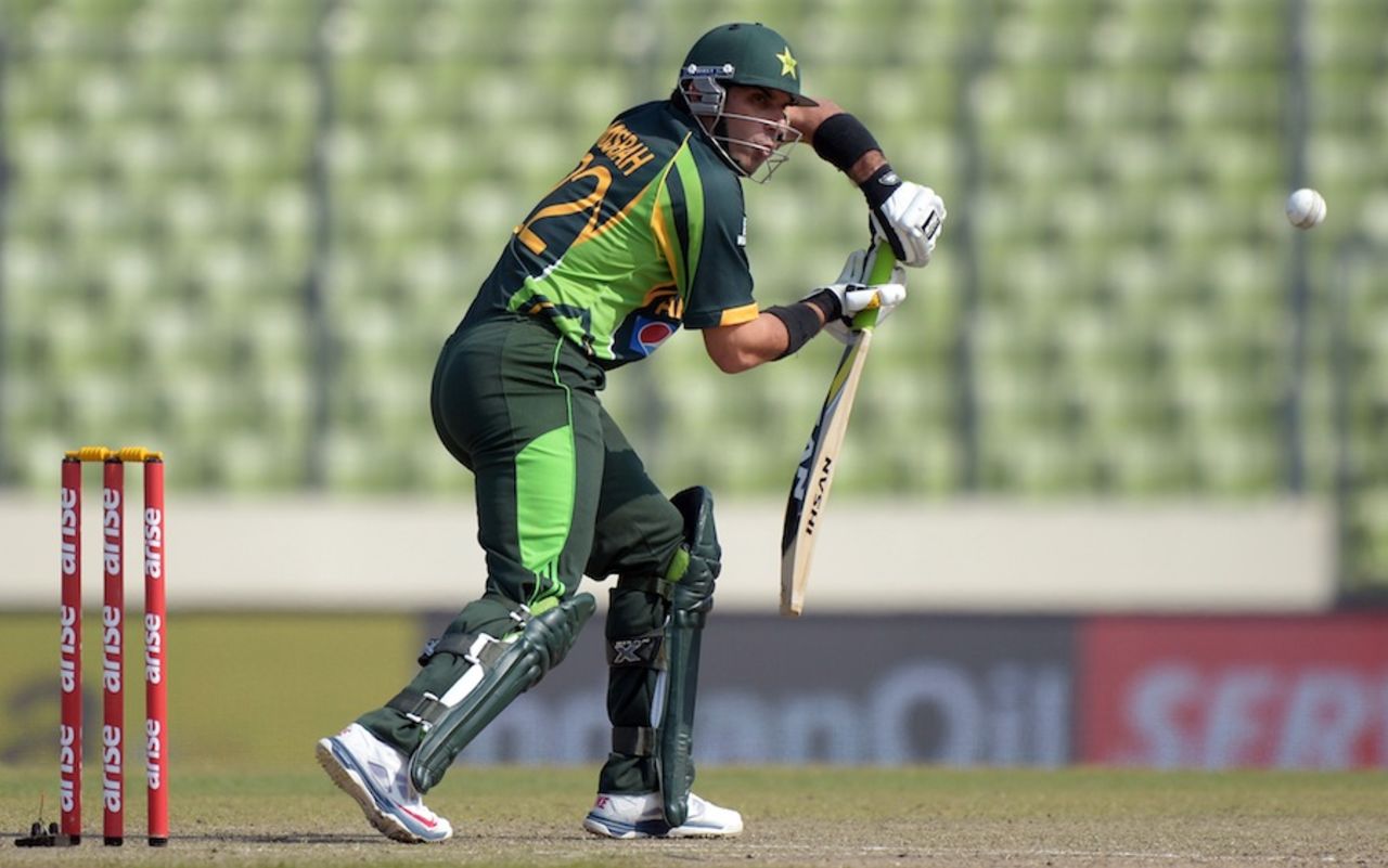 Misbah-ul-Haq defends with a forward lean, Pakistan v Sri Lanka, Asia Cup final, Mirpur, March 8, 2014