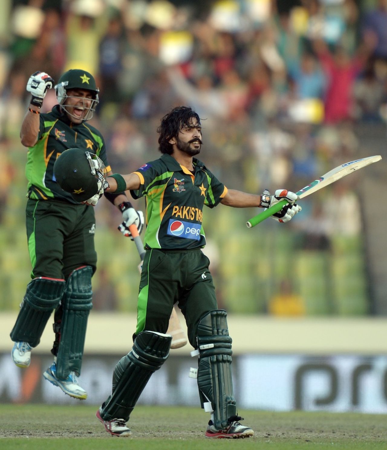 Fawad Alam is joined by Umar Akmal for the celebrations, Pakistan v Sri Lanka, Asia Cup final, Mirpur, March 8, 2014