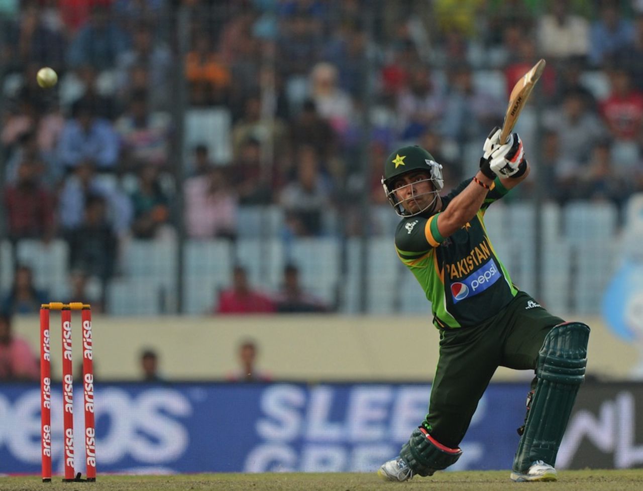 Umar Akmal goes over the covers, Pakistan v Sri Lanka, Asia Cup final, Mirpur, March 8, 2014