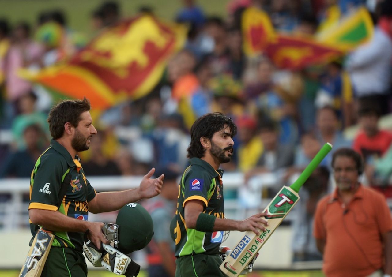 Shahid Afridi and Fawad Alam walk back after the innings, Pakistan v Sri Lanka, Asia Cup final, Mirpur, March 8, 2014
