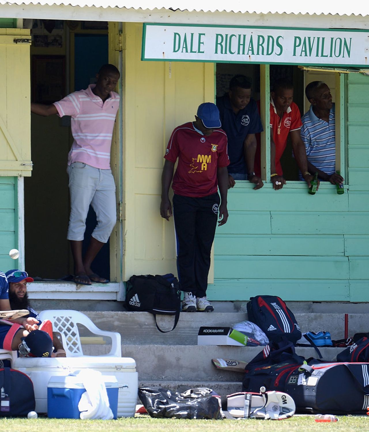The locals keep an eye on England's training session, Isolation Cricket Club, Barbados, March 8, 2014