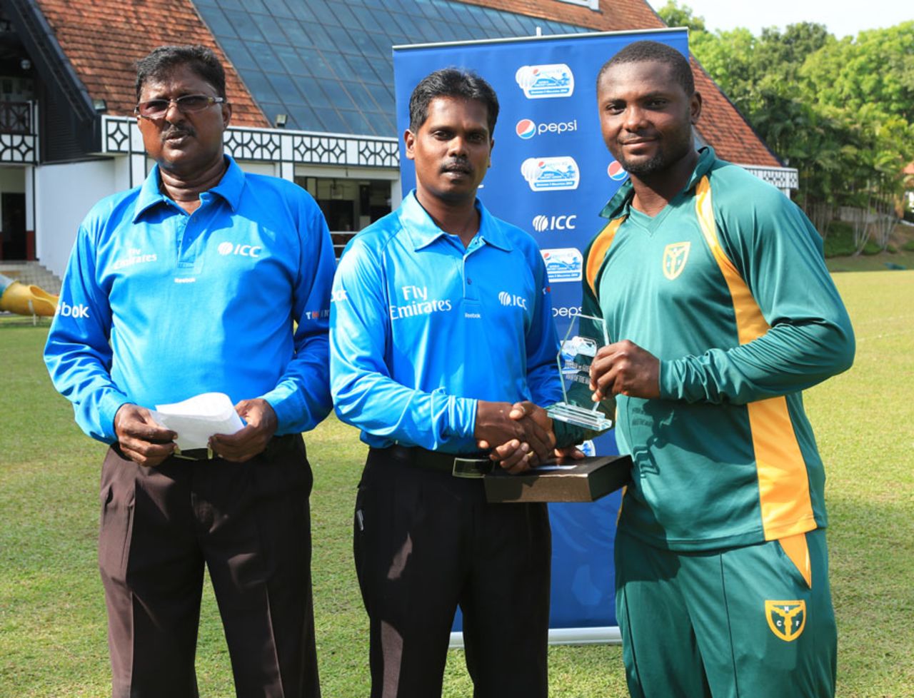 Endurance Ofem receives the Man-of-the-Match award, Nigeria v Guernsey, ICC World Cricket League Division Five, Kuala Lumpur, March 7, 2014