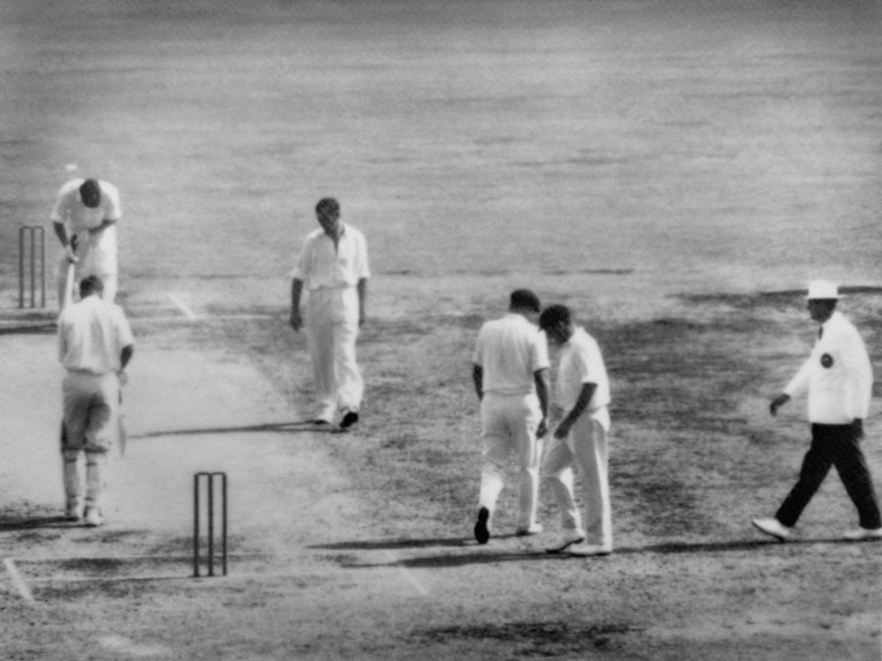 A dejected Ian Meckiff walks along the pitch after being no-balled thrice in the over, Australia v South Africa, 1st Test, Brisbane, 2nd day, December 7, 1963