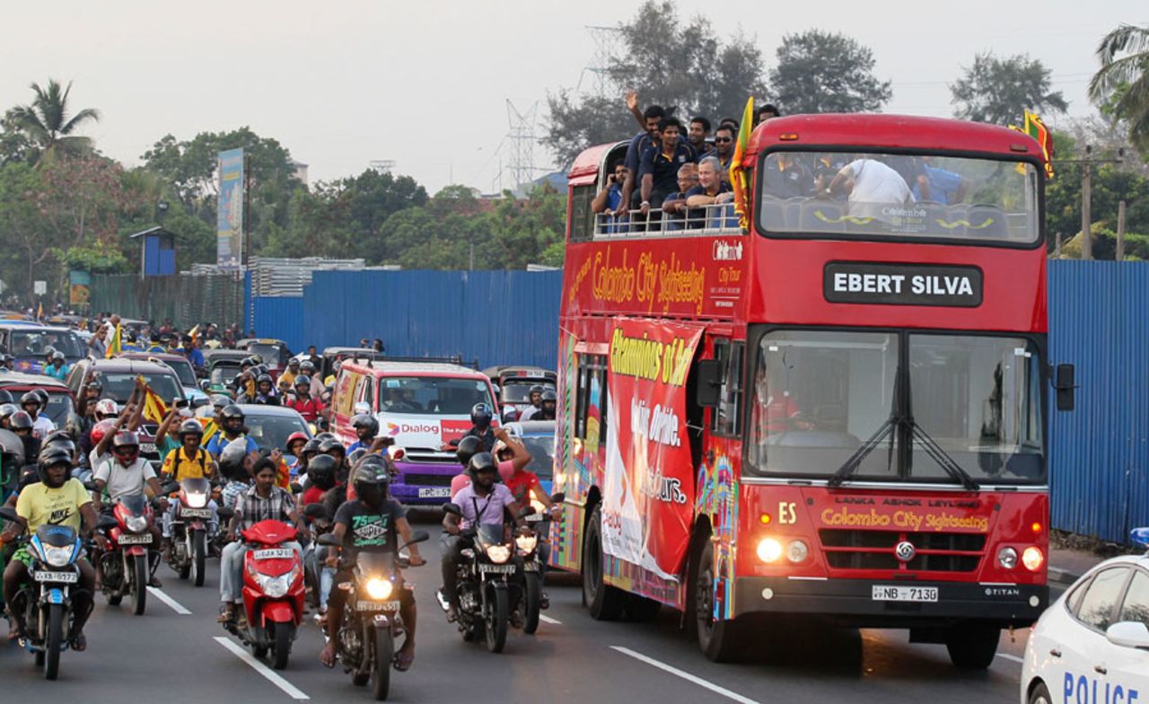 The Sri Lanka team on an open-top bus to celebrate their Asia Cup triumph, Colombo, March 9, 2014