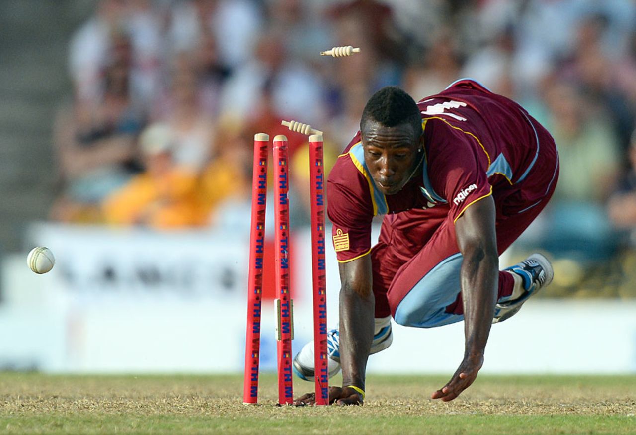 Andre Russell completes the run out of James Tredwell, West Indies v England, 1st T20, Barbados, March 9, 2014