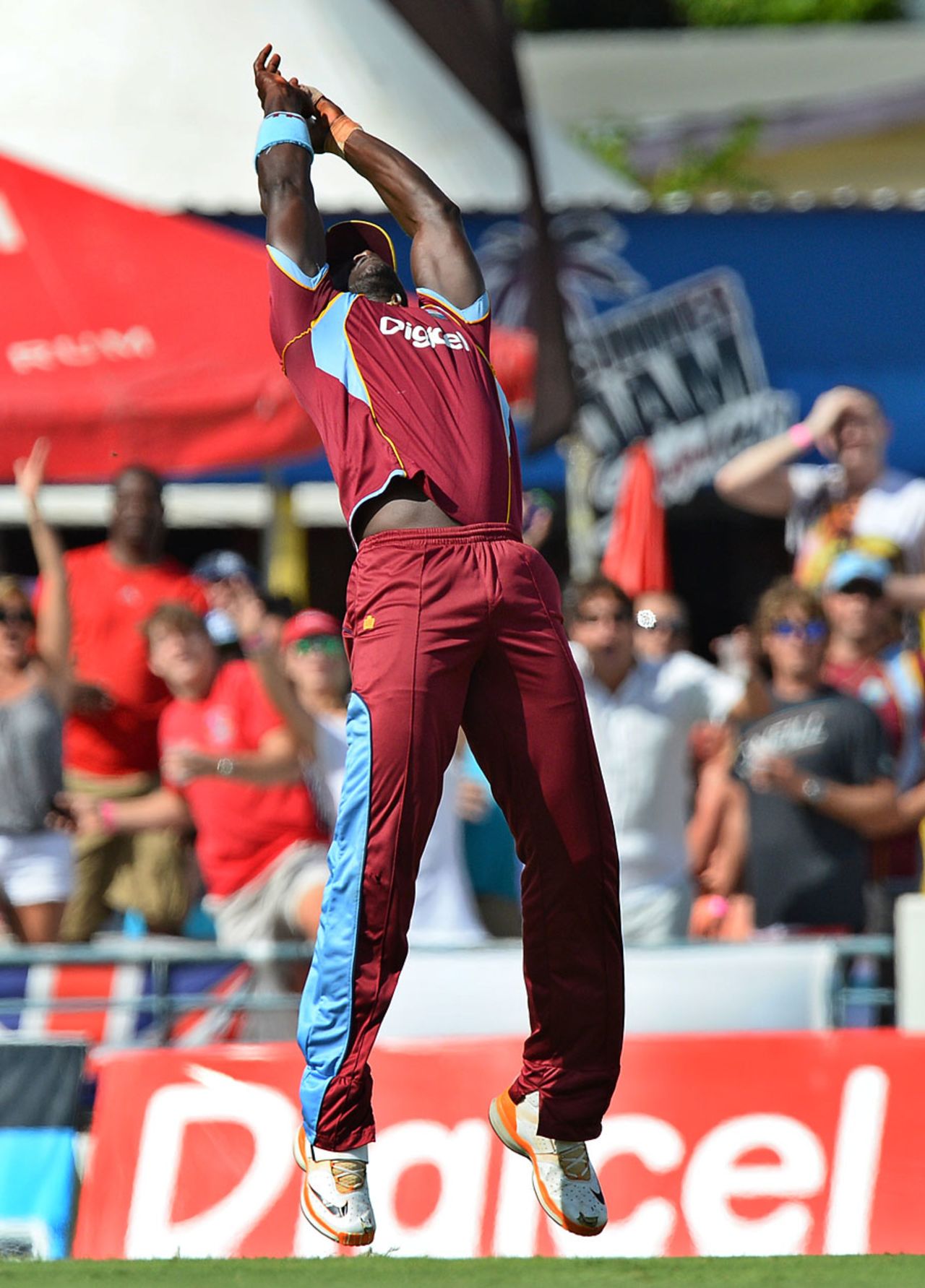 Darren Sammy clings onto a catch to remove Jos Buttler, West Indies v England, 3rd T20, Barbados, March 13, 2014