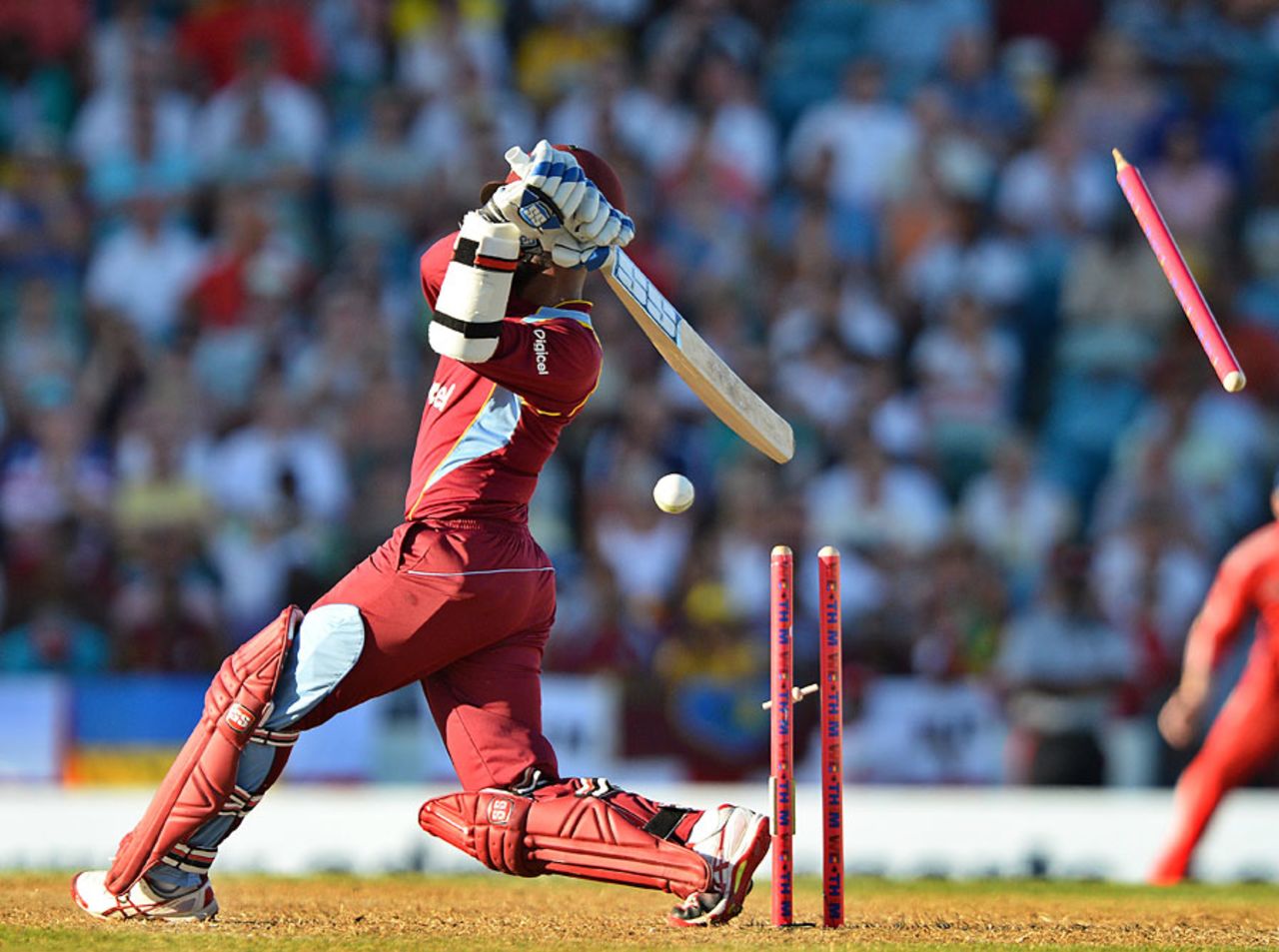 A stump goes flying as Denesh Ramdin misses, West Indies v England, 3rd T20, Barbados, March 13, 2014