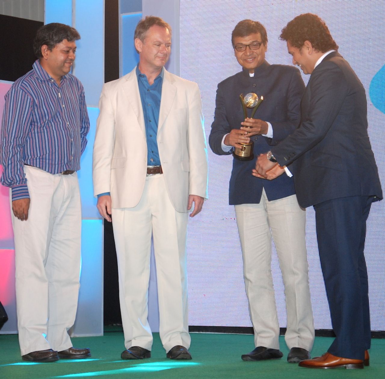 Sachin Tendulkar accepts the award from Sambit Bal and ESPNcricinfo founders, Simon King and Badri Seshadri, Mumbai, March 14, 2014