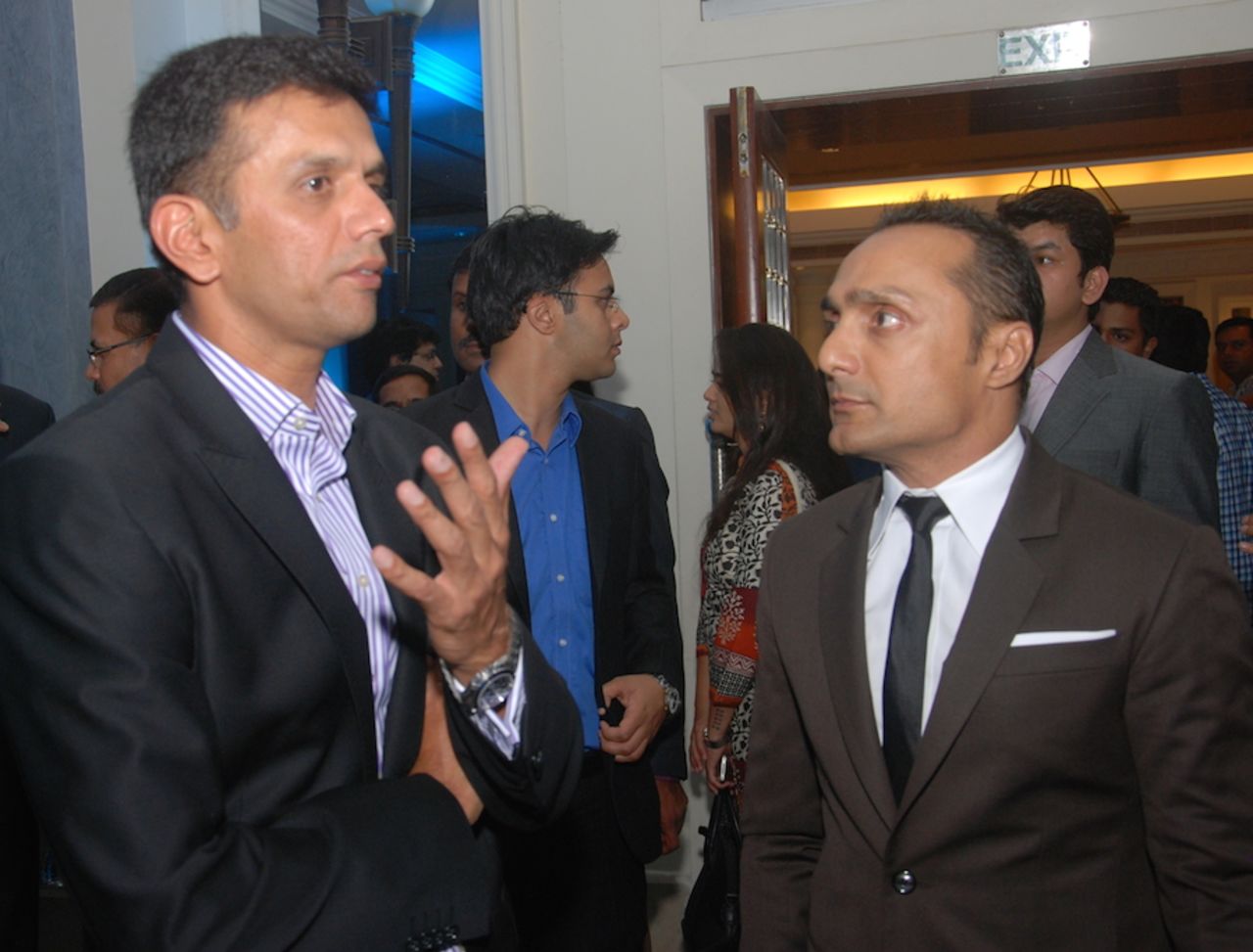 Rahul Dravid and Rahul Bose interact during the ESPNcricinfo awards, Mumbai, March 14, 2014