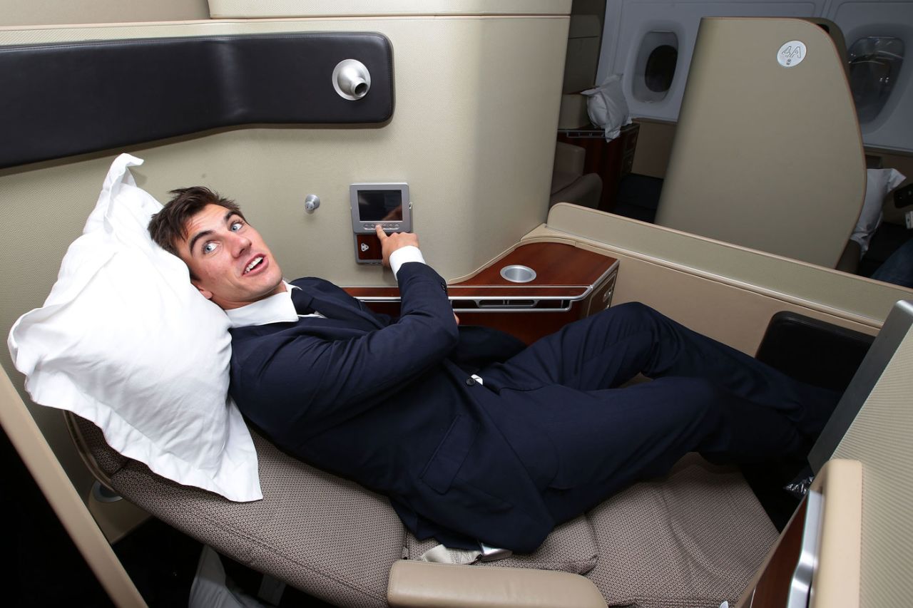 Pat Cummins checks out the business class beds during a farewell event for the Australian team at Sydney airport, Sydney, May 22, 2013