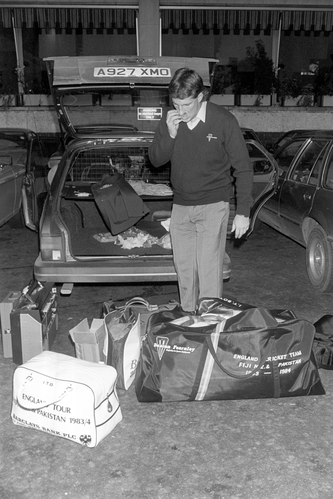 Ian Botham wonders how to put all his luggage into the car before departing on England's tour of Fiji, New Zealand and Pakistan, December 28, 1983