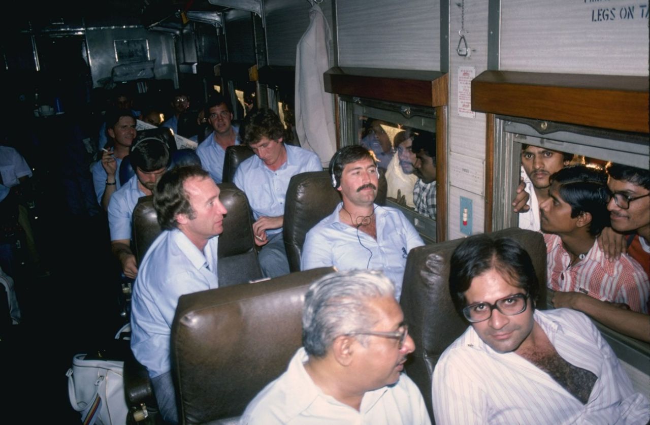 Fans on the platform look at Graham Gooch and Keith Fletcher sitting on the train headed from Bombay to Poona, November 1, 1981