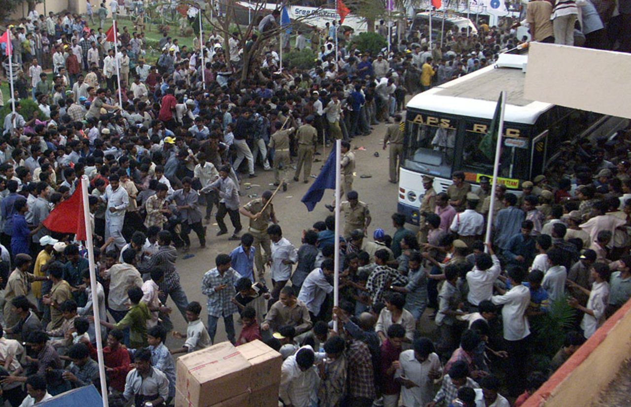 Police use force to push away fans surrounding the Australian team bus, Visakhapatnam, April 3, 2001