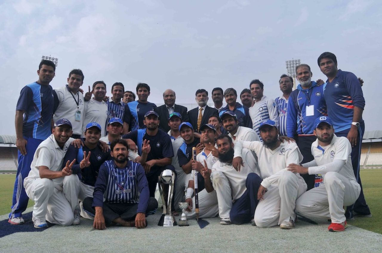 The SNGPL players pose with the trophy, United Bank Limited v Sui Northern Gas Pipelines Limited, President's Trophy final, Multan, March 15, 2014