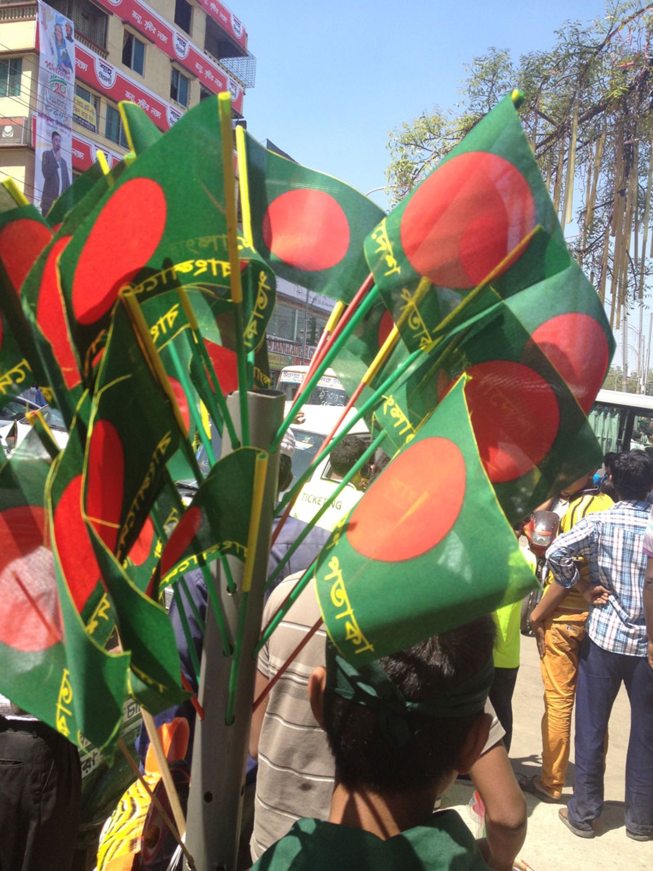 A flag vendor in Mirpur displays his wares ahead of the World T20 opener, Mirpur, March 16, 2014