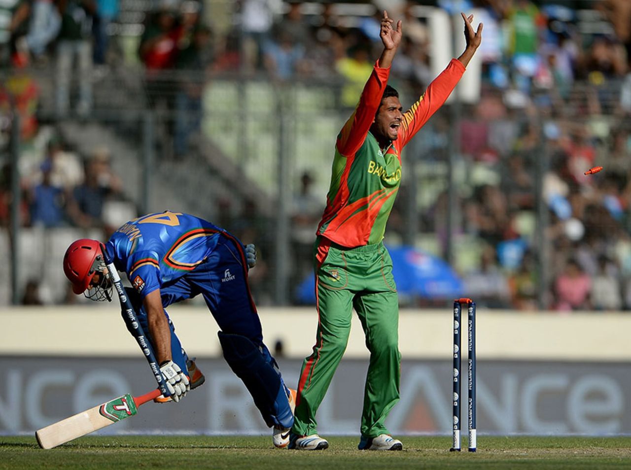 Mahmudullah celebrates as Nawroz Mangal is run out by a direct hit from Sabbir Rahman, Bangladesh v Afghanistan, World T20, Qualifying Group A, March 16, 2014