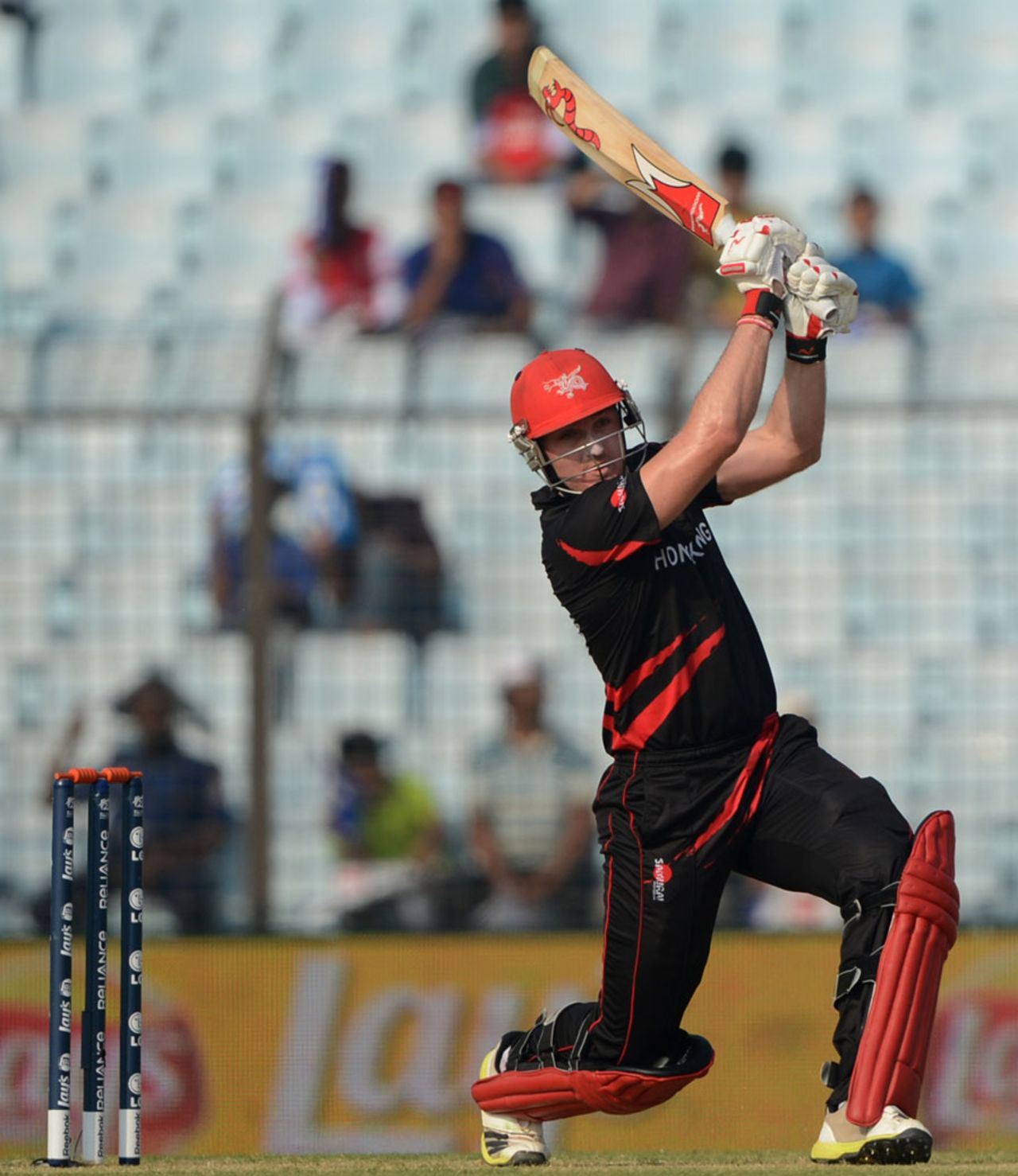 Jamie Atkinson muscles the ball through the off side, Afghanistan v Hong Kong, World T20, Group A, Chittagong, March 18, 2014