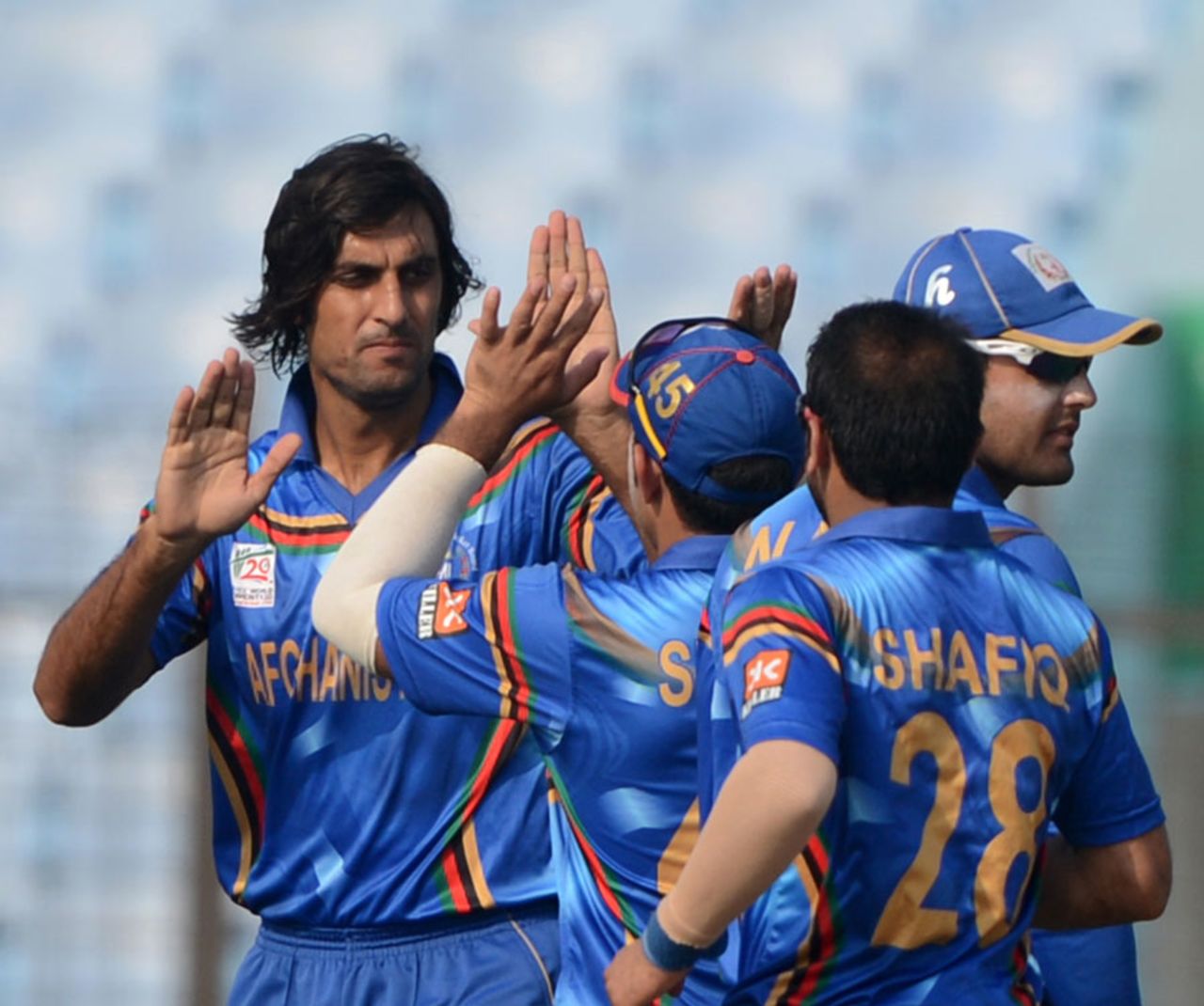 Shapoor Zadran celebrates with team-mates after dismissing Irfan Ahmed, Afghanistan v Hong Kong, World T20, Group A, Chittagong, March 18, 2014