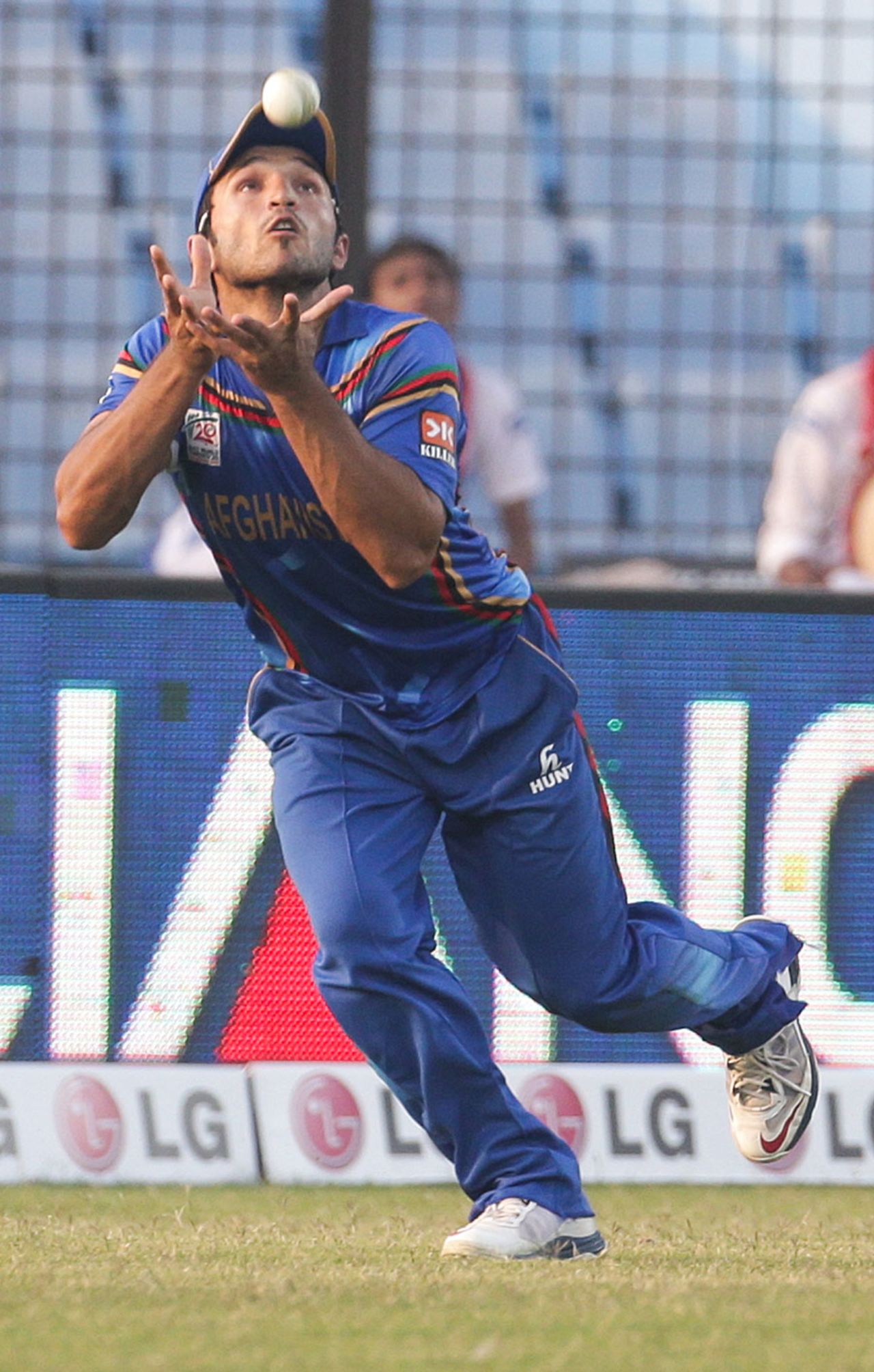 Gulbadin Naib gets under the ball in the outfield, Afghanistan v Hong Kong, World T20, Group A, Chittagong, March 18, 2014