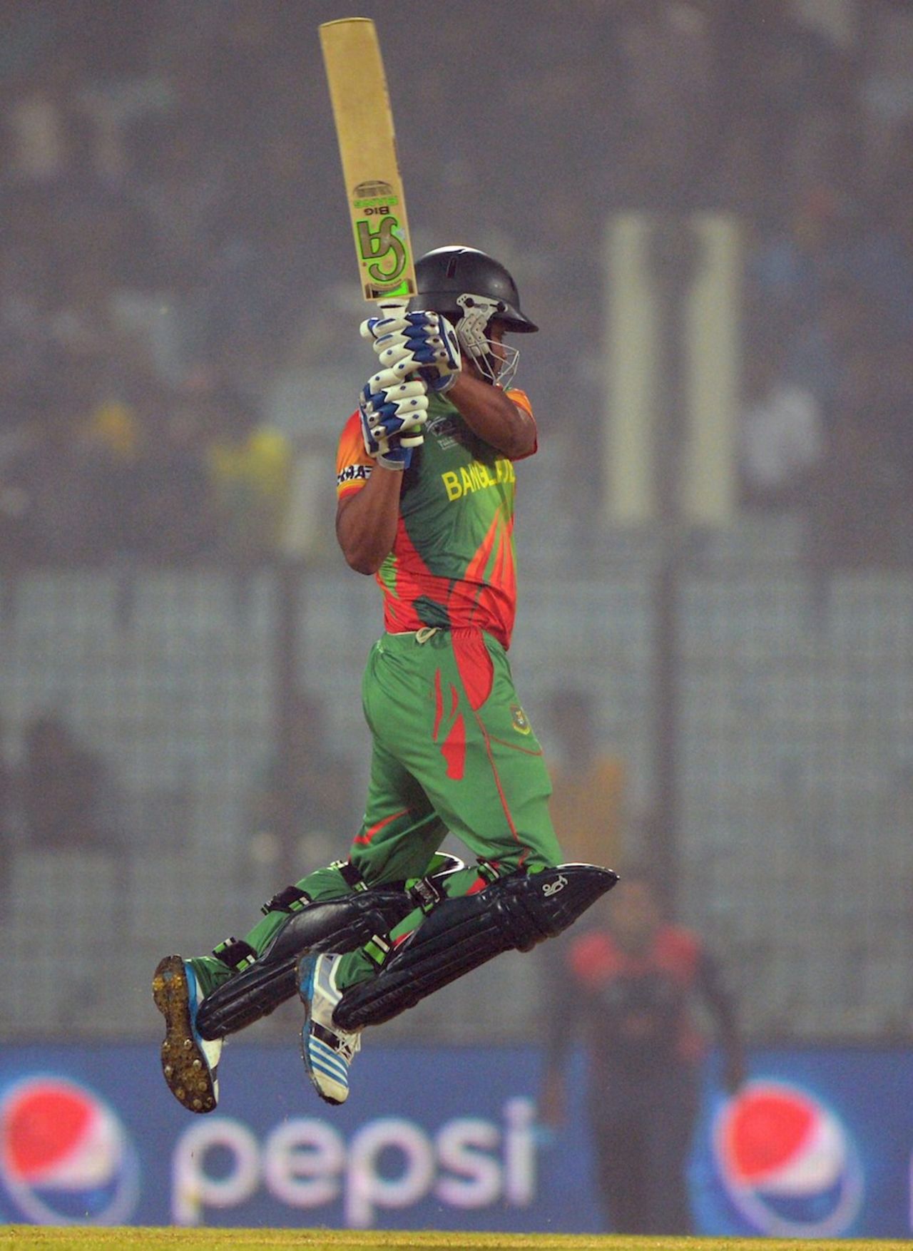 Tamim Iqbal is off the ground as he plays a punch through off, Bangladesh v Nepal, World T20, Group A, Chittagong, March 18, 2014