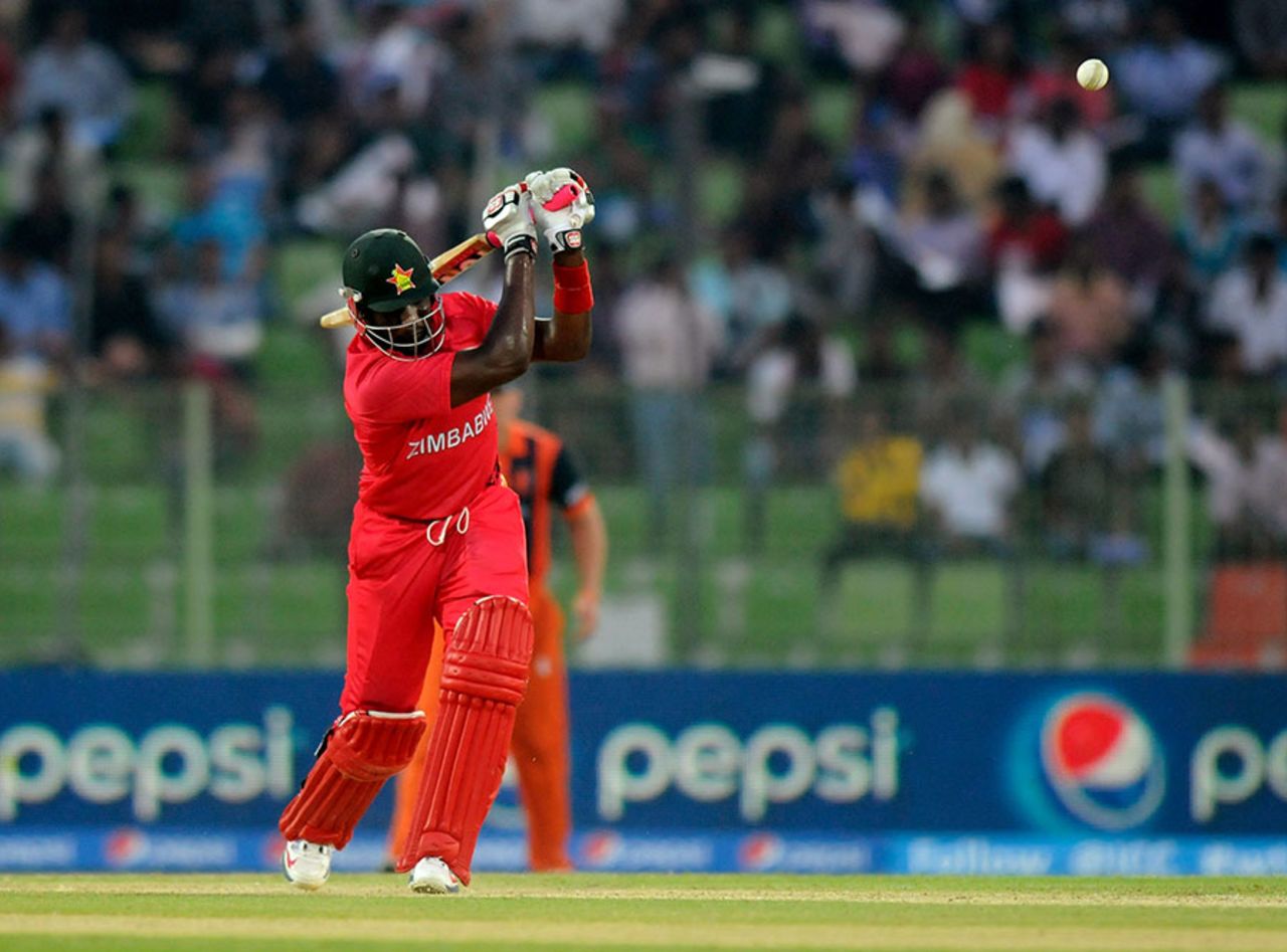 Hamilton Masakadza hits over the top during his innings of 43, Netherlands v Zimbabwe, World T20, First Round Group B, Sylhet, March 19, 2014 