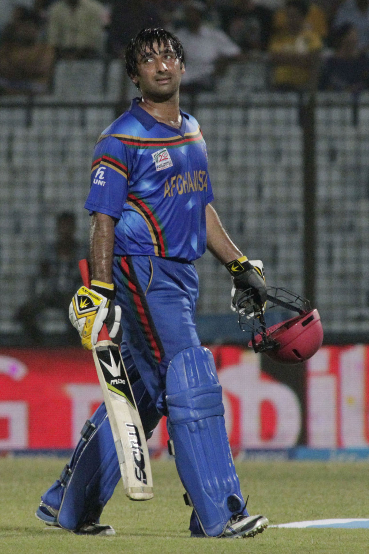 Asghar Stanikzai walks back after being dismissed for 49, Afghanistan v Nepal, World Twenty20, Group A, Chittagong, March 20, 2014