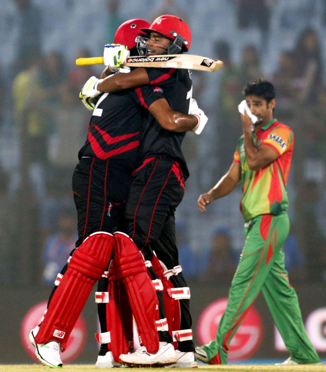 Haseeb Amjad and Nadeem Ahmed celebrate after the winning hit, Bangladesh v Hong Kong, World T20, Group A, Chittagong, March 20, 2014
