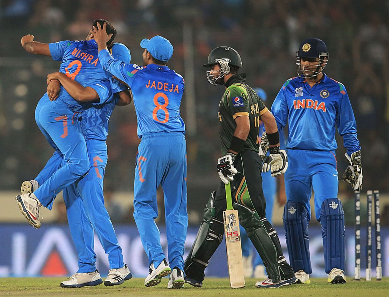 Amit Mishra is the center of attention after getting Ahmed Shehzad stumped, India v Pakistan, Group 2, Mirpur, March 21, 2014 