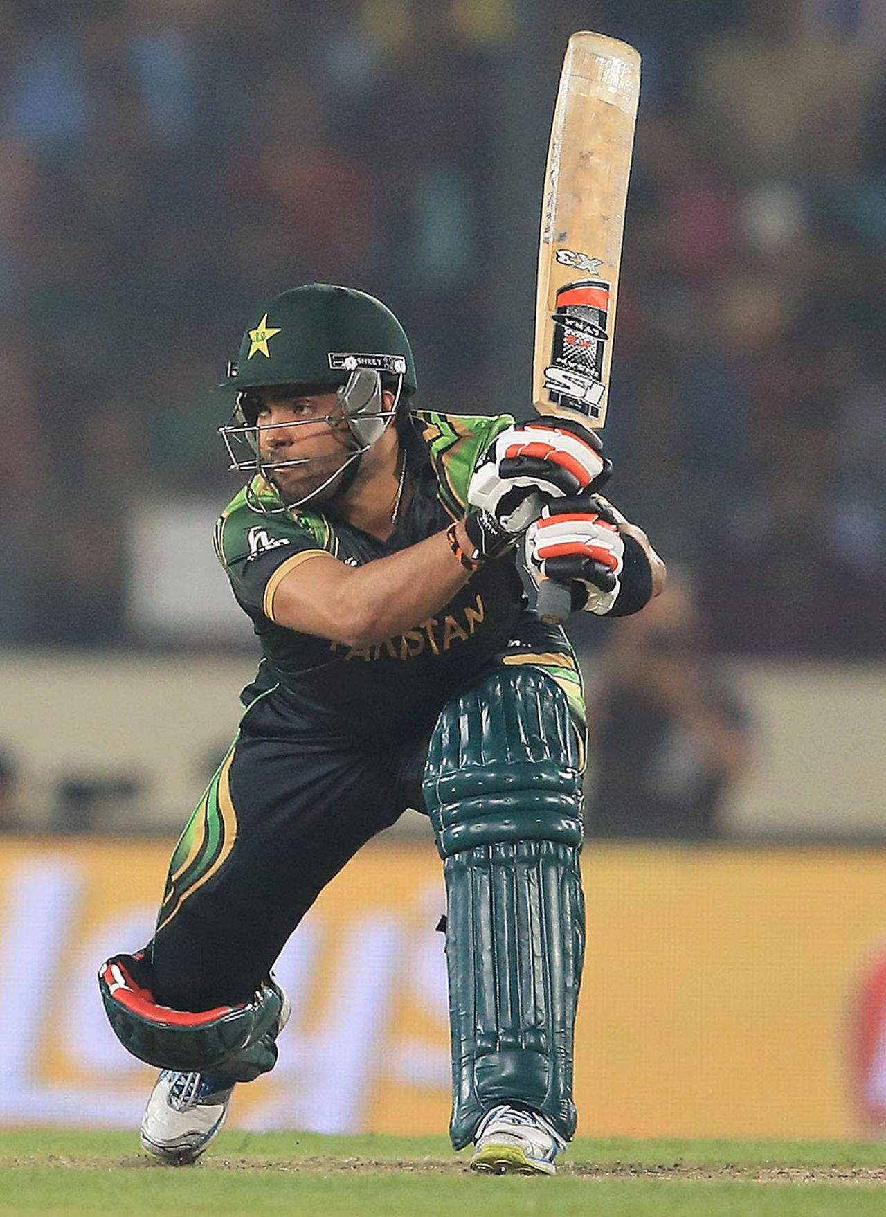 Umar Akmal forces it through the off side, India v Pakistan, World T20, Group 2, Mirpur, March 21, 2014 