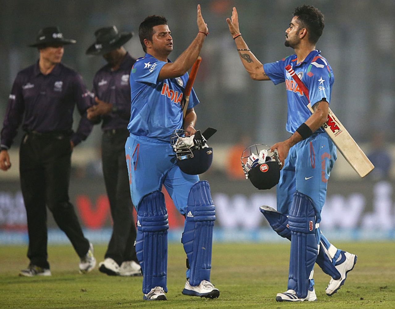 Suresh Raina and Virat Kohli celebrate India's win, India v Pakistan, World T20, Group 2, Mirpur, March 21, 2014 