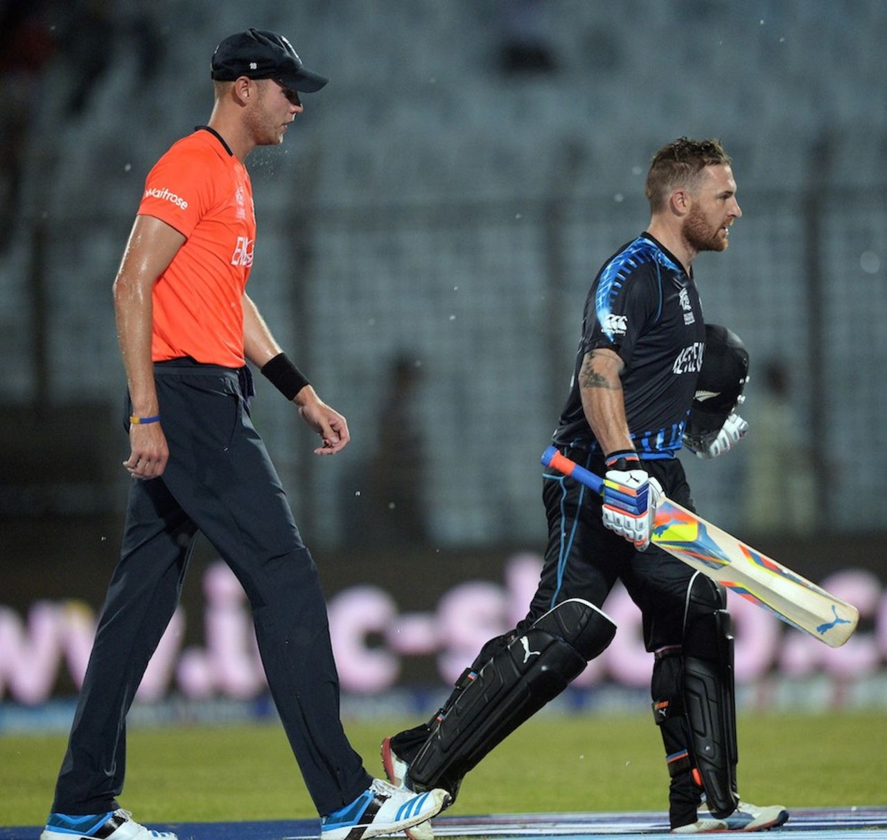 Brendon McCullum and Stuart Broad trudge off the field as it starts to pour, England v New Zealand, World T20, Group 1, Chittagong, March 22, 2014
