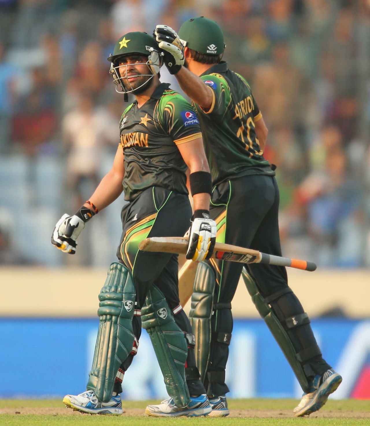Shahid Afridi consoles Umar Akmal after the latter was out for 94, Australia v Pakistan, World T20, Group 2, Mirpur, March 23, 2014
