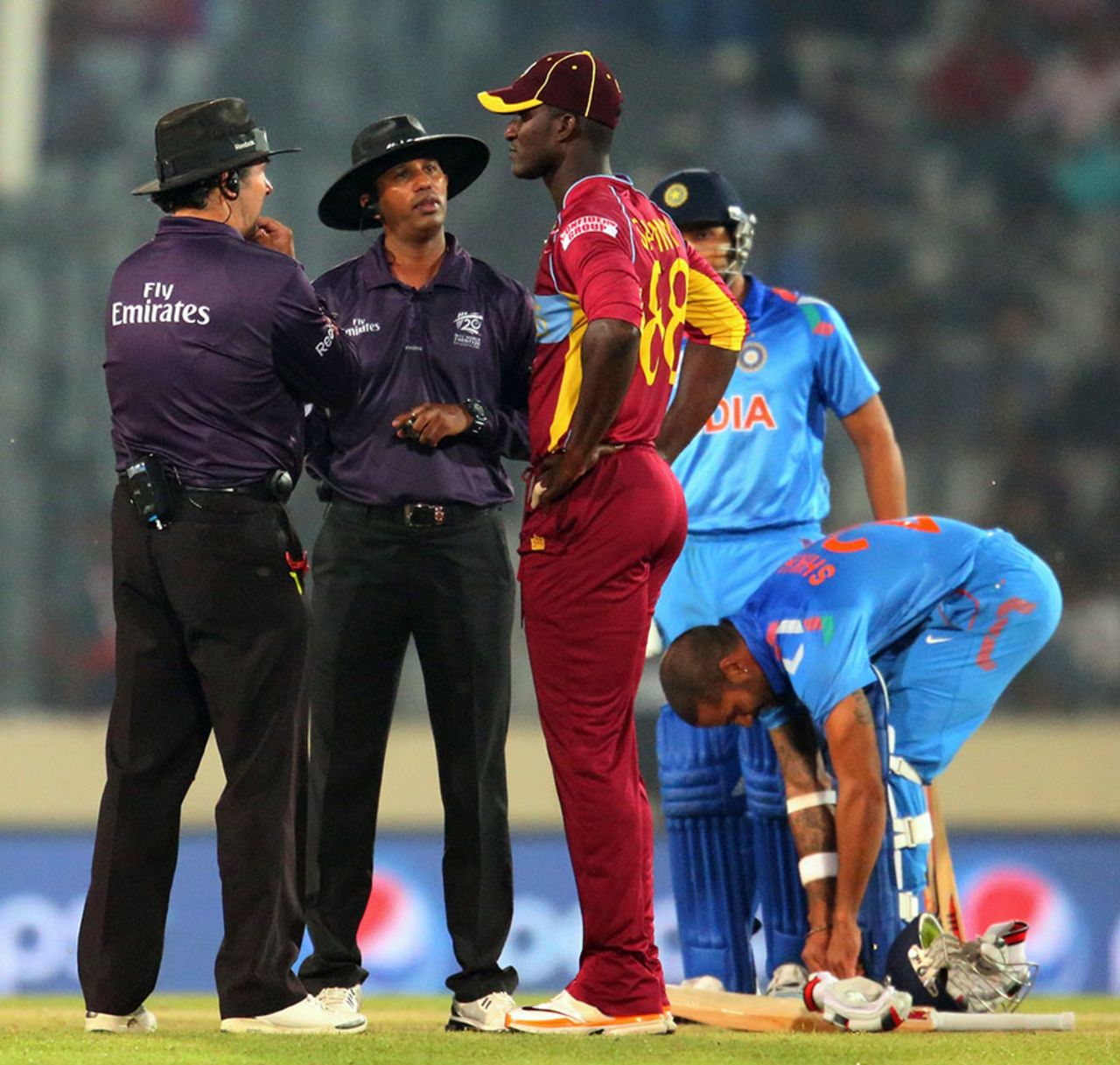 Darren Sammy talks to the umpires as the start of India's innings is delayed by a no-ball review,  India v West Indies, World T20, Group 2, Mirpur, March 23, 2014