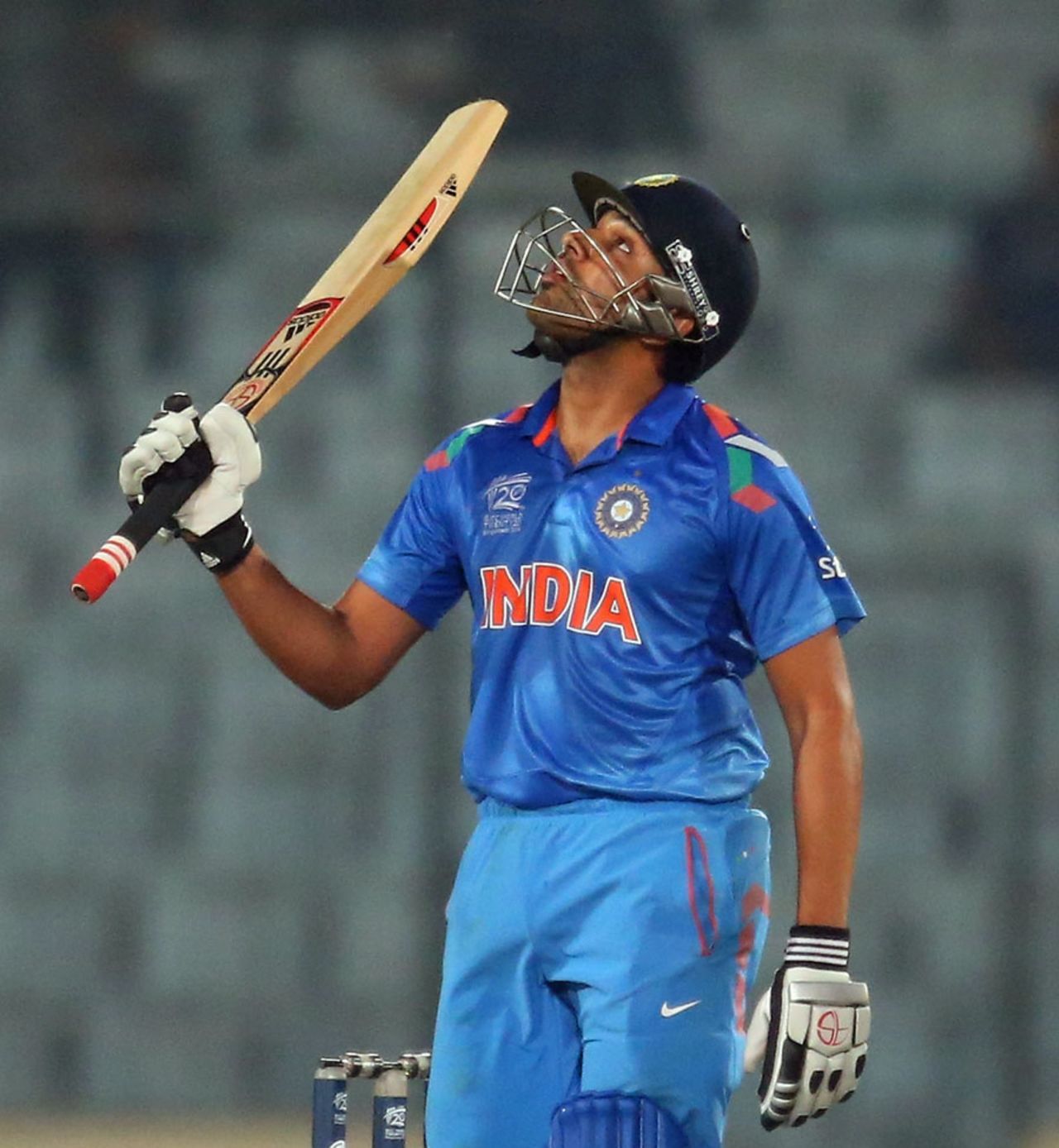 Rohit Sharma raises his bat after reaching a half-century,  India v West Indies, World T20, Group 2, Mirpur, March 23, 2014