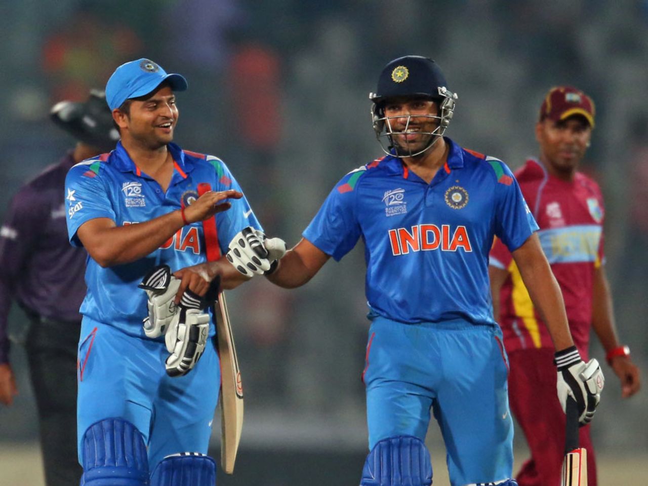 Suresh Raina and Rohit Sharma walk off after India's win,  India v West Indies, World T20, Group 2, Mirpur, March 23, 2014