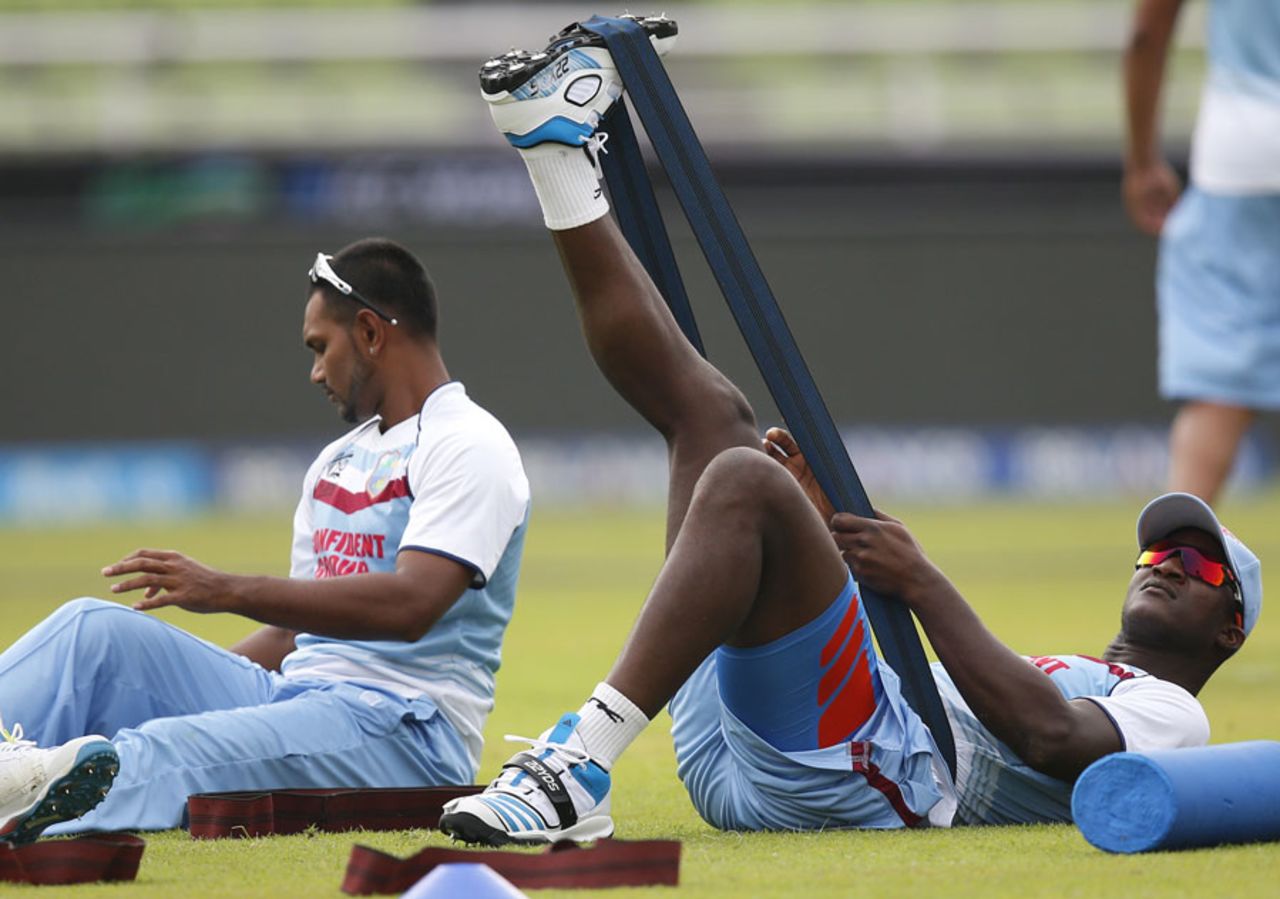 Darren Sammy stretches during a training session, Mirpur, March 24, 2014
