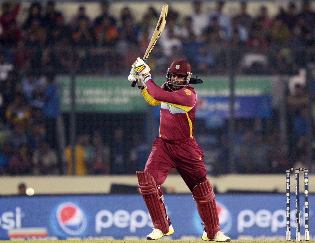 Chris Gayle slaps the ball into the off side, Bangladesh v West Indies, World T20, Group 2, Mirpur, March 25, 2014