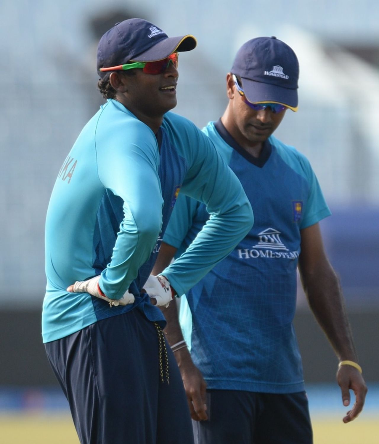 Mysterious turn: Nuwan Kulasekara watches Ajantha Mendis twist his shoulders, Chittagong, March 26, 2014