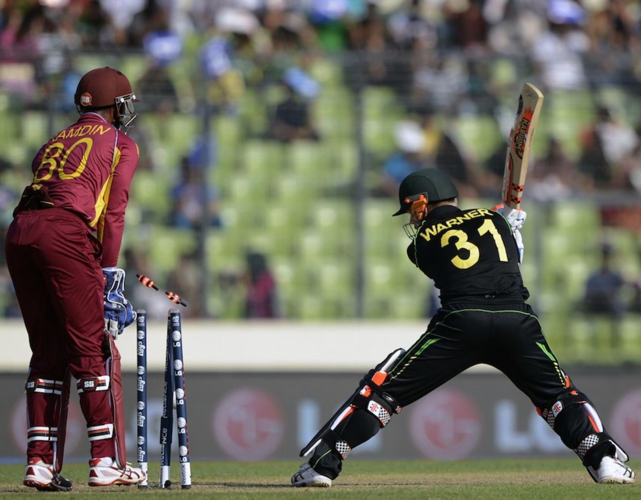 David Warner is bowled by a quicker one from Samuel Badree, Australia v West Indies, World T20, Group 2, Mirpur, March 28, 2014