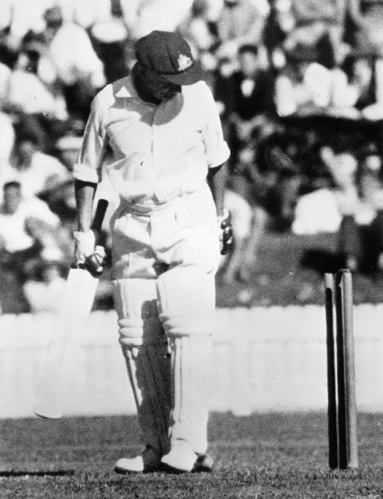 Don Bradman looks back at his stumps after being dismissed for the last time, Australians PM XI v England, Canberra, February 3, 1963