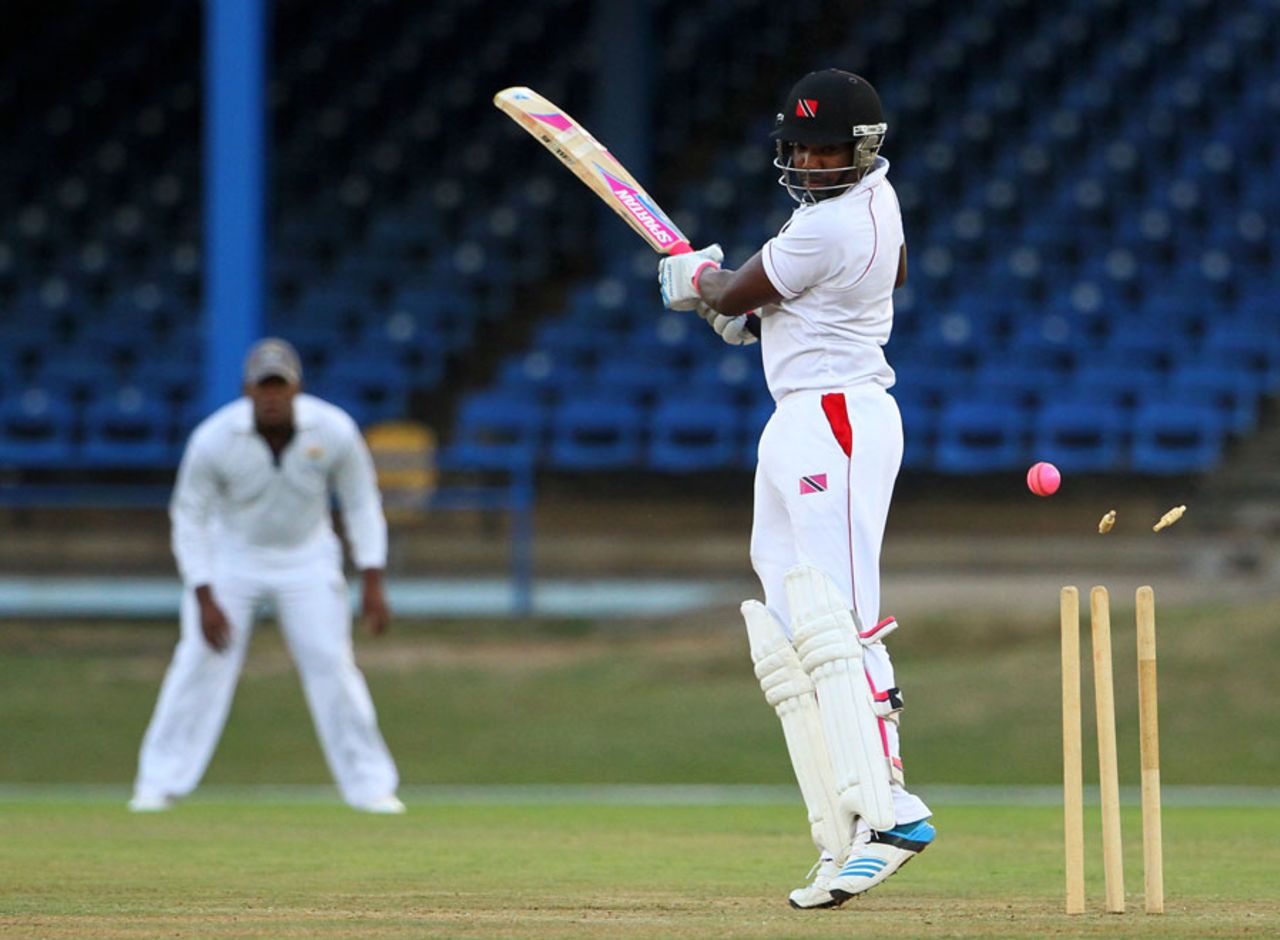 Darren Bravo drags the ball onto his stumps, Trinidad & Tobago v Combined Campuses and Colleges, Regional Four Day Competition, Port of Spain, March 28, 2014, Day 1