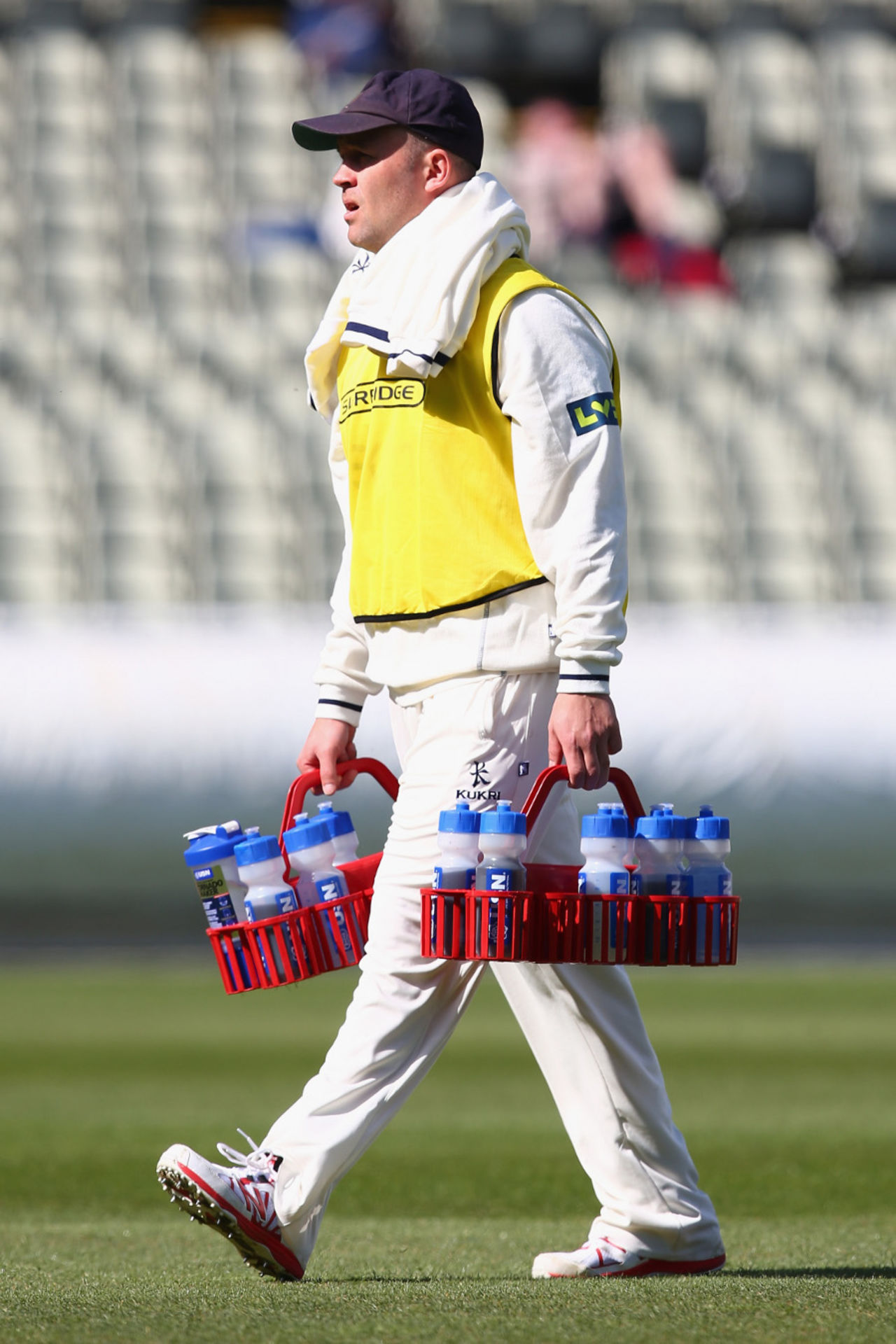 Jonathan Trott carries the drinks, Warwickshire v Gloucestershire, Edgbaston, April 1, 2014