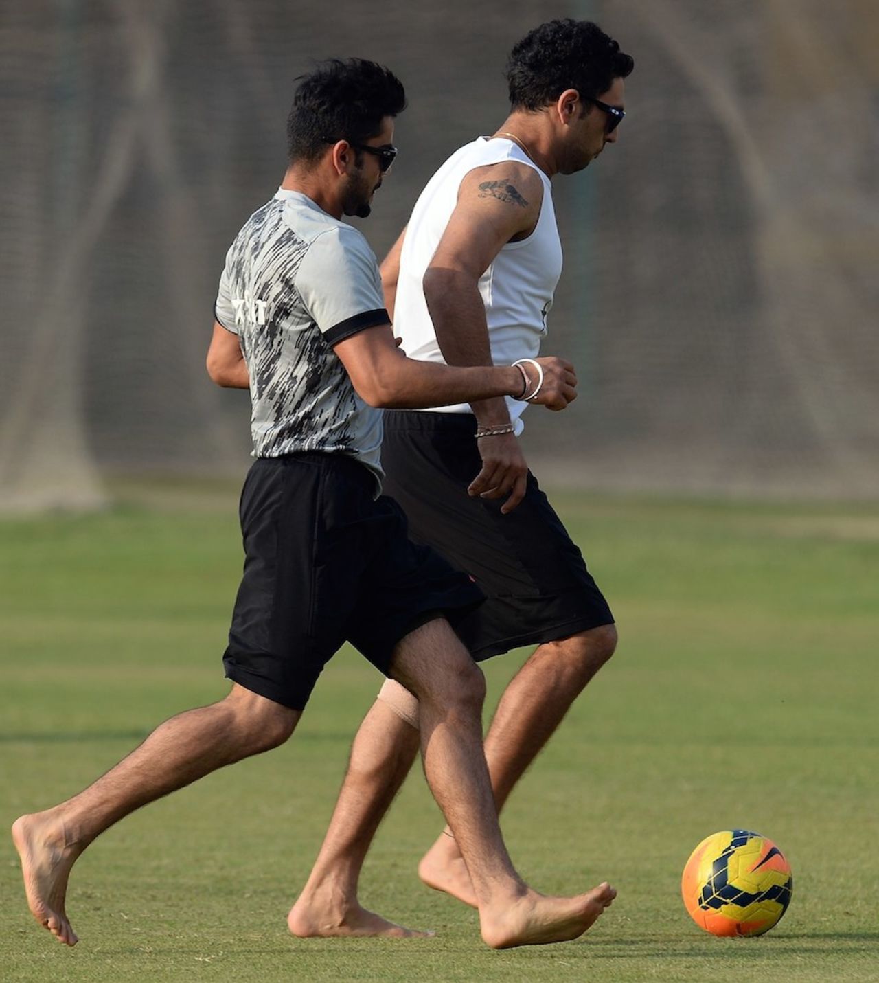 Happy feet: Virat Kohli and Yuvraj Singh during their football training, Dhaka, April 1, 2014