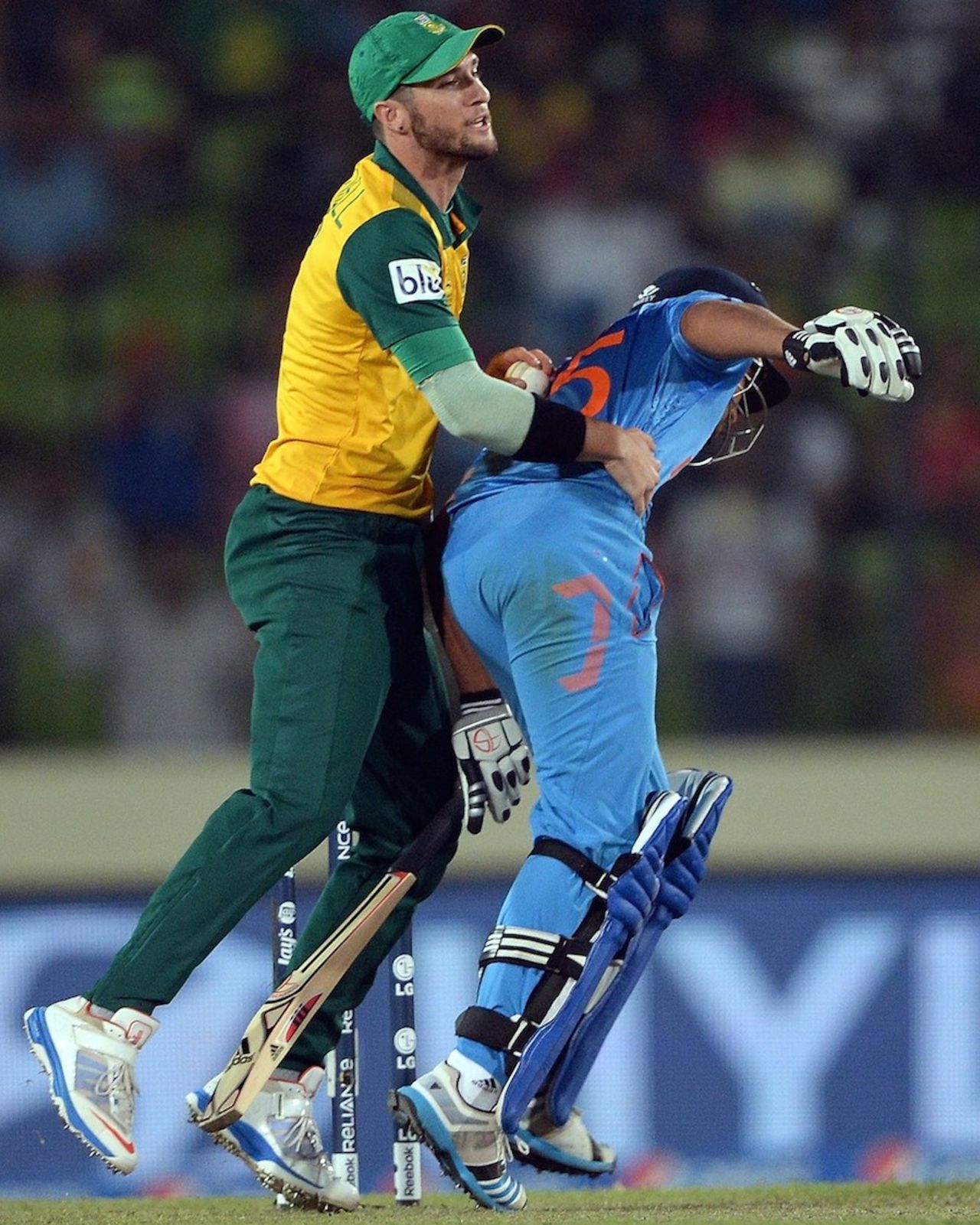 Wayne Parnell collides with Rohit Sharma, India v South Africa, World T20, semi-final, Mirpur, April 4, 2014