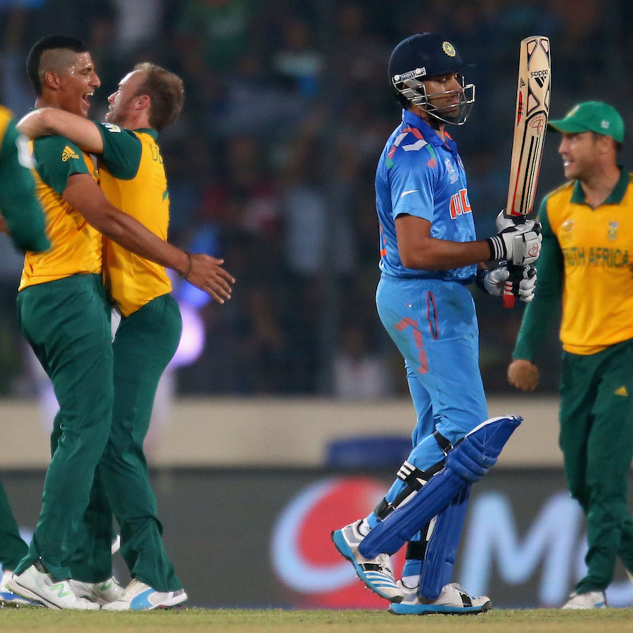 Beuran Hendricks and AB de Villiers celebrate the wicket of Rohit Sharma, India v South Africa, World T20, semi-final, Mirpur, April 4, 2014