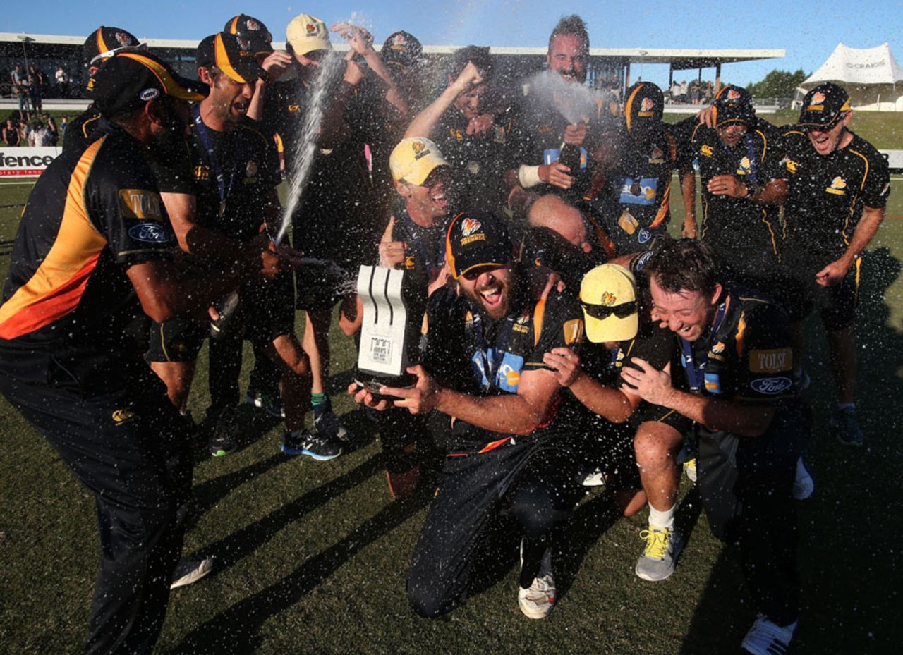 The Wellington side celebrate their Ford Trophy title victory, Northern Districts v Wellington, The Ford Trophy final, Mount Maunganui, April 5, 2014